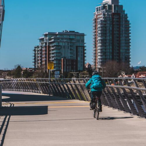 cyclist biking in Victoria on a sunny day